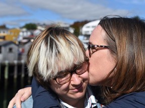 Jill Holroyd (right), from Renfrew, gives her transgender son a kiss. She said, "It's really important to listen and believe what your child is telling you."