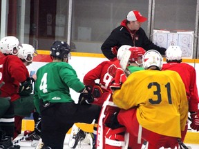 Pembroke Lumber Kings's head coach Alex Armstrong draws out a drill for the players during practice at the Pembroke and Area Community Centre Feb. 23. The Kings will face the Carleton Place Canadians in four showcase games over the next two weekends.