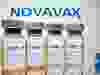 Vials and medical syringe are seen in front of Novavax logo in this illustration