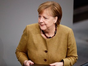 German Chancellor Angela Merkel leaves following her speech on the government's response to the COVID-19 pandemic, at the country's parliament, the Bundestag, in Berlin on Feb. 11.