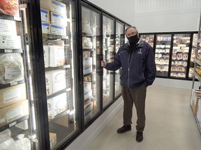 Ricco Foods owner Don Windsor Sr. stands beside a new freezer bank inside the Ricco Foods Cash and Carry Store. (Carl Hnatyshyn/Strathroy Age Dispatch)