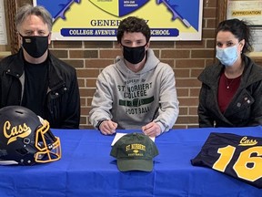 College Avenue athlete Gavin Gall, pictured with parents Chip and Michelle, recently signed a letter of intent to play NCAA Division 3 football at St. Norbert College in Wisconsin.