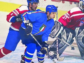 TIME PASSAGES -- Soo boys John Glavota (left) of the Croatian National Team and John Parco (right) of the Italian National Team compete against each other in international hockey play from more than a dozen years ago.