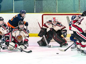 Blind River Beavers goalie Gavin Disano keeps his eyes on the puck in heavy traffic during recent Northern Ontario Jr. Hockey League action against the Soo Thunderbirds. A Sault Ste. Marie product, Disano was a standout as Blind River earned a tough road point from a 6-5 shootout loss to the Thunderbirds. BOB DAVIES