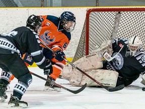 Soo Thunderbirds forward Caleb Wood (second from left) hunts down a rebound in front of Espanola netminder Owen Willis in NOJHL action earlier this year. Wood has agreed to play for Sault College Cougars this season. Photo courtesy NOJHL