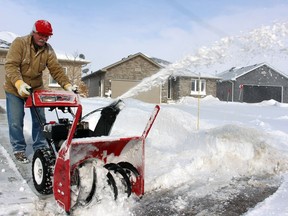 John Raven clears snow from his driveway on Tuesday February 16, 2021 in Petrolia, Ont. Terry Bridge/Sarnia Observer/Postmedia Network