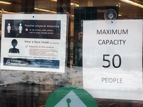 A sign advising customers about a 50-person limit is seen here on Monday February 22, 2021 in Petrolia, Ont. (Terry Bridge/Sarnia Observer)