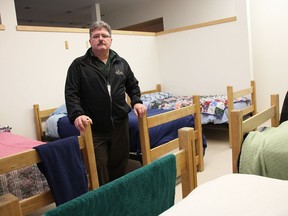 Myles Vanni stands by some of the beds at the Good Shepherd's Lodge in Sarnia, in December 2018.