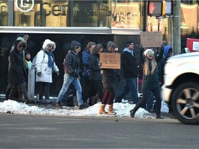 A group of protesters against mask mandates, lockdowns and the great reset make their way along 109 Avenue in Edmonton on Sunday, Nov. 21, 2020. PHOTO BY ED KAISER /Postmedia