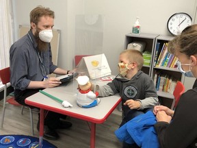 Derek Caldwell, a Lansdowne Children's Centre speech language pathologist, works with a client and parent in the Preschool Speech and Language program at one of Lansdowne's Simcoe sites. CONTRIBUTED PHOTO