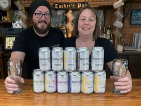 Craig Watkins and Sarah Fritch of Backyard Brewing show off some of their creations at the Blue Elephant in Simcoe. The couple are part of group effort that has opened up Norfolk County's newest brewery. They are working with Barb Rideout and John Harris. VINCENT BALL/BRANTFORD EXPOSITOR