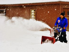 The heaviest snowfall of the winter so far in southern Ontario dropped nearly a foot of the white stuff in some places Tuesday. Helping the neighbourhood on Greenock Street West in Port Dover dig out was Paul Bartlett, of Port Dover. – Monte Sonnenberg