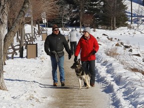 People go for a walk near Bell Park in Sudbury, Ont.