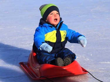 Avery, 2, went for a ride on the Ramsey Lake skating path in Sudbury, Ont., thanks to his mom, Rachelle St-Denis, on Monday February 1, 2021. John Lappa/Sudbury Star/Postmedia Network