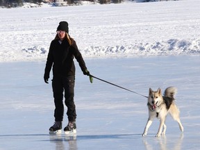 Brittney Gouthro goes for a skate with Nala on the Ramsey Lake skating path on Feb. 1.