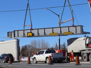 Workers install a section of Vale's railway bridge in Copper Cliff, Ont. on Wednesday February 3, 2021. The city said in a release that work on the bridge will close the southbound lane all day Thursday and the centre lane all day Friday. Motorists can expect delays. John Lappa/Sudbury Star/Postmedia Network