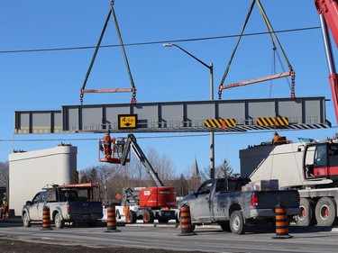 Workers install a section of Vale's railway bridge in Copper Cliff, Ont. on Wednesday February 3, 2021. The city said in a release that work on the bridge will close the southbound lane all day Thursday and the centre lane all day Friday. Motorists can expect delays. John Lappa/Sudbury Star/Postmedia Network