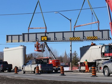 Workers install a section of Vale's railway bridge in Copper Cliff, Ont. on Wednesday February 3, 2021. The city said in a release that work on the bridge will close the southbound lane all day Thursday and the centre lane all day Friday. Motorists can expect delays. John Lappa/Sudbury Star/Postmedia Network