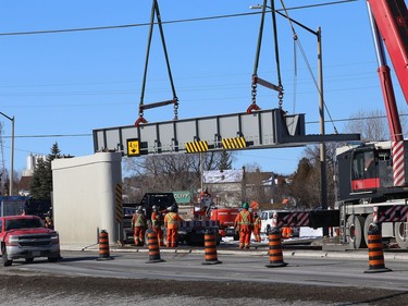 Workers install a section of Vale's railway bridge in Copper Cliff, Ont. on Wednesday February 3, 2021. The city said in a release that work on the bridge will close the southbound lane all day Thursday and the centre lane all day Friday. Motorists can expect delays. John Lappa/Sudbury Star/Postmedia Network