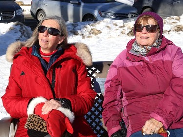 Vicki Alemany, left, and Helen Craig relax while catching some rays near Bell Park in Sudbury, Ont. on Thursday February 4, 2021. John Lappa/Sudbury Star/Postmedia Network