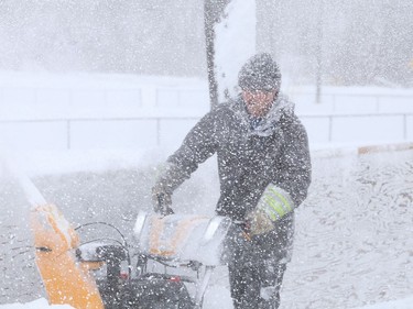 City employee Brady Moore uses a snowblower to clear snow off the rink at Elm West Playground in Sudbury, Ont. on Friday February 5, 2021. John Lappa/Sudbury Star/Postmedia Network