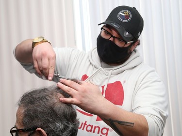 Adam Saidane, of Ben's Barbershop at 19 Durham St. in Sudbury, Ont., opened his business again after having to close because of the second province-wide shutdown. John Lappa/Sudbury Star/Postmedia Network