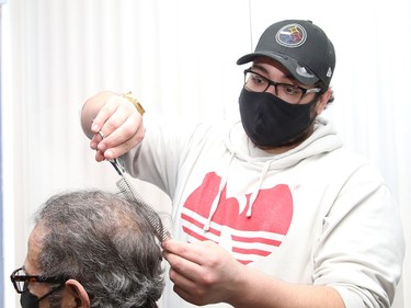Adam Saidane, of Ben's Barbershop at 19 Durham St. in Sudbury, Ont., opened his business again after having to close because of the second province-wide shutdown. John Lappa/Sudbury Star/Postmedia Network