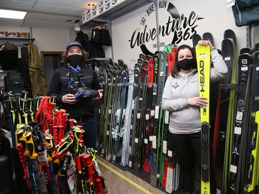 Jay Thomson, left, and Melissa Anderson, of Adventure 365 at 444 Barrydowne Rd. in Sudbury, Ont., display some of the products available at the store on Tuesday February 16, 2021. The business has reopened after closing the storefront because of the second province-wide shutdown. John Lappa/Sudbury Star/Postmedia Network