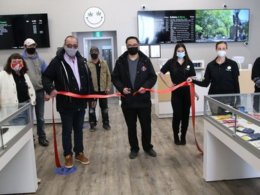 City councillor Bill Leduc and owner John Law cut a ribbon  to officially open Happy Life at 1021 the Kingsway in Sudbury, Ont. on Tuesday February 16, 2021. The business sells wholesale cannabis products. John Lappa/Sudbury Star/Postmedia Network