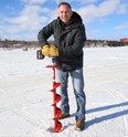 Andre Grandchamp, group manager of media sales at The Sudbury Star and North Bay Nugget, checks the thickness of the ice on Ramsey Lake in Sudbury, Ont. on Wednesday February 17, 2021. The annual Sudbury Star Ice Guessing contest has kicked off. John Lappa/Sudbury Star/Postmedia Network