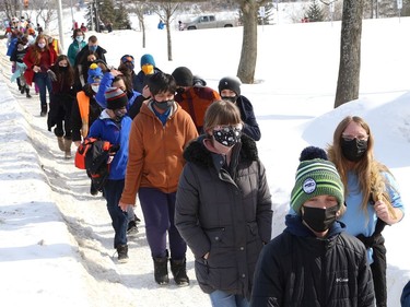 Some students and staff from MacLeod Public School walked in support of the Coldest Night of the Year campaign in Sudbury, Ont. on Thursday February 18, 2021. The school raised more than $7,000 for the event. The Samaritan Centre is hosting its 10th annual Coldest Night of the Year event this Saturday. Because of the pandemic, the event will be virtual only. Participants are being encouraged to walk in their family units or in groups of less than five, socially distanced. A Facebook group and event page has been set up where people can post photos or videos. Individuals who wish to participate can sign up a team, register to walk, or make a donation by visiting www.cnoy.org/location/sudbury. John Lappa/Sudbury Star/Postmedia Network