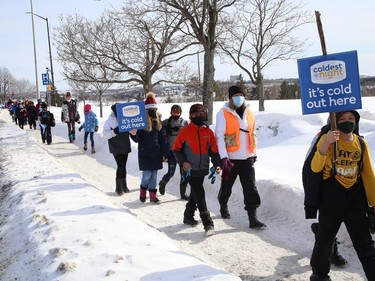 Some students and staff from MacLeod Public School walked in support of the Coldest Night of the Year campaign in Sudbury, Ont. on Thursday February 18, 2021. The school raised more than $7,000 for the event. The Samaritan Centre is hosting its 10th annual Coldest Night of the Year event this Saturday. Because of the pandemic, the event will be virtual only. Participants are being encouraged to walk in their family units or in groups of less than five, socially distanced. A Facebook group and event page has been set up where people can post photos or videos. Individuals who wish to participate can sign up a team, register to walk, or make a donation by visiting www.cnoy.org/location/sudbury. John Lappa/Sudbury Star/Postmedia Network