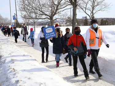 Some students and staff from MacLeod Public School walked in support of the Coldest Night of the Year campaign in Sudbury, Ont. on Thursday February 18, 2021. The school raised more than $7,000 for the event. The Samaritan Centre is hosting its 10th annual Coldest Night of the Year event this Saturday. Because of the pandemic, the event will be virtual only. Participants are being encouraged to walk in their family units or in groups of less than five, socially distanced. A Facebook group and event page has been set up where people can post photos or videos. Individuals who wish to participate can sign up a team, register to walk, or make a donation by visiting www.cnoy.org/location/sudbury. John Lappa/Sudbury Star/Postmedia Network