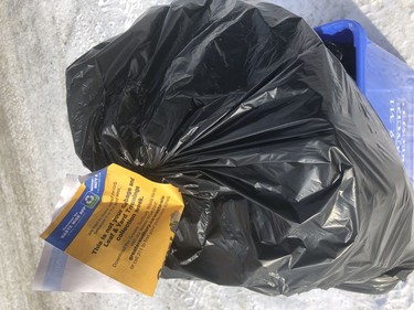These bright yellow stickers are a common sight across the city as some residents still havenÕt noticed the cityÕs garbage pick-up schedule recently changed. A maximum of two garbage bags gets picked up now every second week. Harold Carmichael/Sudbury Star/Postmedia Network