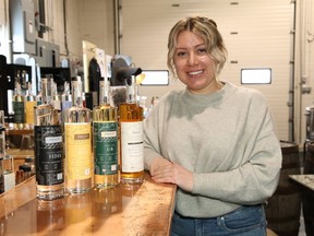 Corissa Blaseg, of Crosscut Distillery in Sudbury, Ont., displays a selection of award winning products on Tuesday February 23, 2021. Crosscut's Triple Grain Vodka won gold recently at the 2021 Canadian Artisan Spirit Competition, while two other products won silver and a liqueur won bronze. John Lappa/Sudbury Star/Postmedia Network
