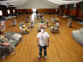 Richard Pacey, of Hope for Sudbury, shows an area where homeless people are living in an auditorium at the former Mine Mill building on Regent Street on Tuesday.