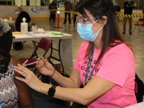 Public health nurses provided the first dose of the COVID-19 vaccine to more than 2,000 long-term care home staff and essential caregivers at a clinic last week in Minnow Lake.