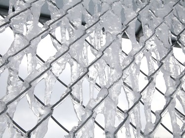 Ice clings to a fence at the Oja Sports Complex in Naughton, Ont. on Friday February 26, 2021. John Lappa/Sudbury Star/Postmedia Network