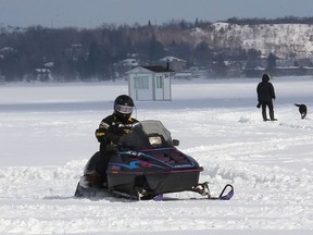 A snowmobile travels across Ramsey Lake this past winter. The lake is not yet safe for sledding this season, however, and none of the Sudbury Trail Plan routes have been given a green light yet either.