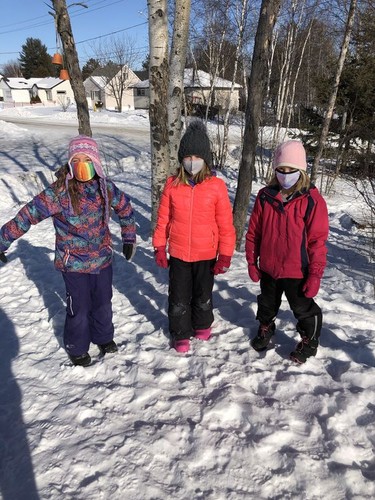 Scarlett Davis, left, Kinsey Spec and Saydee Obdam of Walden Public School enjoy the snow. Rainbow District School Board challenged students to get outside for Winter Walk Day on Wednesday. Supplied photo