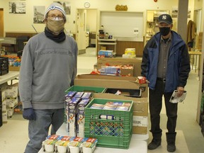 Peter Davis, treasurer at the South Porcupine Food Bank, on left, with Rick Young, chairman at the Timmins Food Bank, said they have been seeing an increase in clients at their respective food banks amid the COVID-19 pandemic. 

RICHA BHOSALE/The Daily Press