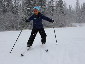 Forest Leduc, 8, was out cross-country skiing with his mom Chantale, at the Porcupine Ski Runners on Friday afternoon. The steady snowfall that benefited Timmins ski trails Friday is expected to taper off to flurries Saturday.

RICHA BHOSALE/The Daily Press