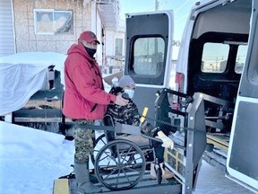 Canadian Ranger Cpl. Dennis Sutherland helps an Elder in Kashechewan into a wheelchai- accessible vehicle to take her to a COVID vaccination site.

Supplied/Sgt. John Sutherland, Canadian Rangers