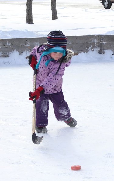 Elloise Lamothe practises her shot while skating with family members at Roy Nicholson Park in Timmins on Monday.

RICHA BHOSALE/The Daily Press