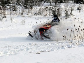 A snowmobiler cuts through a fresh layer of snow along a Timmins trail in this Daily Press file photo.
