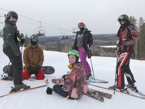 This group of friends, from left, Faith Viel, Kyle Spencer, Liam Spencer, Katie Kirkpatrick and Zack Burns were among the first skiers and snowboarders to take in the opening day since lockdown at Mount Jamieson Resort on Friday morning.

RON GRECH/The Daily Press