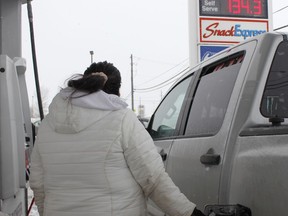 A woman is seen filling up her truck at a gas station on Riverside Drive on Wednesday afternoon. The price of gas, which has been a persistent bane for Timmins motorists, spiked in recent days.

RICHA BHOSALE/The Daily Press