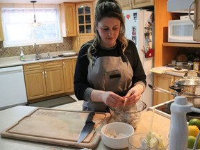 Julie Lefebvre prepares shrimps for a cooking workshop held as part of the Bonhomme Carnaval.

Dariya Baiguzhiyeva/Local Journalism Initiative