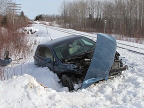 A damaged Toyota Venza sports utility vehicle is seen here just off Fraser Road in Connaught following a collision with train that was travelling through Connaught Thursday morning.

RON GRECH/The Daily Press