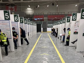 Bruce County paramedics prepare to receive the COVID-19 vaccine inside the Grey Bruce Health Unit's "hockey hub" and mass-immunization centre in Hanover at the P&H Centre. Photo supplied by Bruce County.